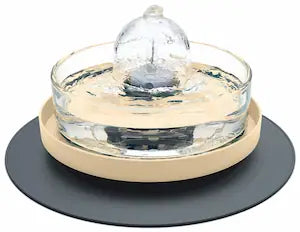 Brook fountain on a beige and dark grey stand and splash mat