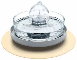 Brook fountain on a grey and beige stand and splash mat