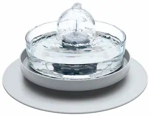 Brook fountain on a grey stand and splash mat