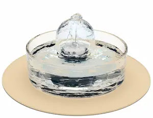 Brook fountain on a beige splash mat