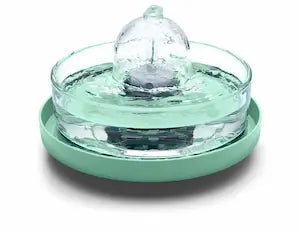 Brook fountain on a green stand