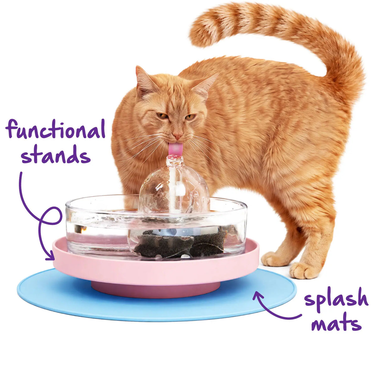 An orange cat drinks from a Brook fountain on a pink functional stand over a blue splash mat.